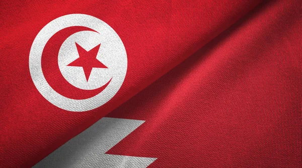 Tunisie et Bahreïn deux drapeaux tissu textile, texture du tissu — Photo