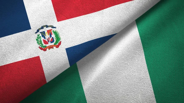 Доминиканская Республика и Нигерия два флага текстильная ткань, текстура ткани — стоковое фото