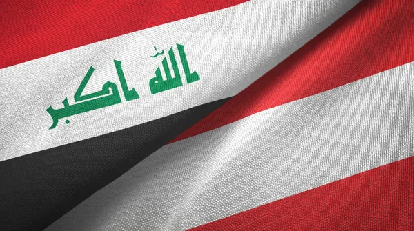 Iraque e Áustria duas bandeiras pano têxtil, textura de tecido — Fotografia de Stock