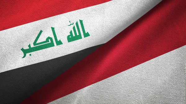 Irak és Indonézia két zászló textil ruhával, szövet textúra — Stock Fotó
