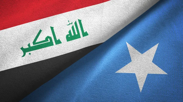Iraque e Somália duas bandeiras de pano têxtil, textura de tecido — Fotografia de Stock