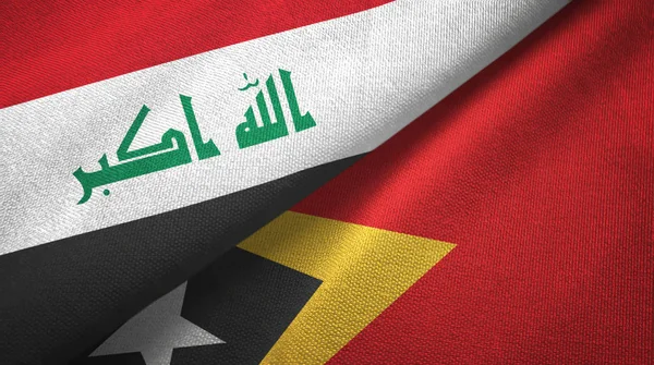 Irak und timor-leste east timor zwei Flaggen Textilstoff, Textilstruktur — Stockfoto
