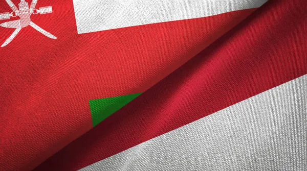 Oman and Indonesia two flags textile cloth, fabric texture — Stock Photo, Image