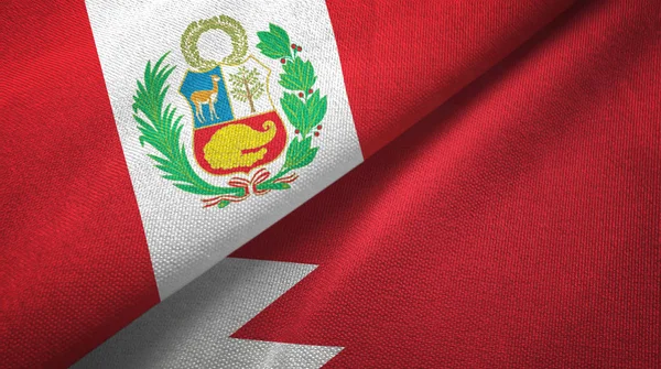 Peru a Bahrato dvě vlajky textilní tkaniny, textura textilií — Stock fotografie