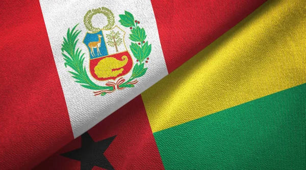Перу і Гвінеї-Бісау два прапори текстильна тканина, текстура тканини — стокове фото