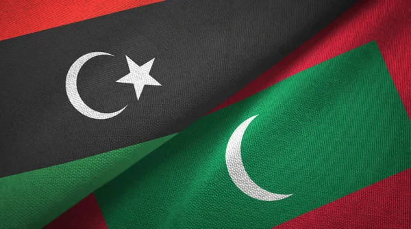 Libye a Maledivy dvě vlajky textilní tkaniny, textura textilií — Stock fotografie