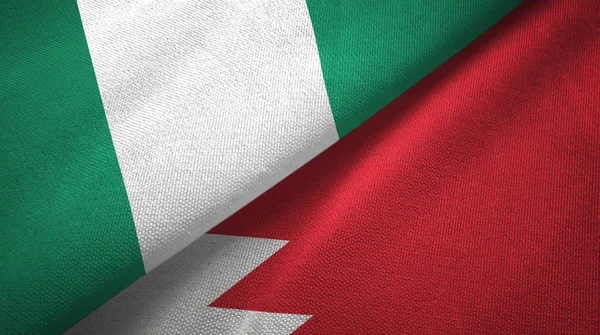 Nigéria e Bahrein duas bandeiras de pano têxtil, textura de tecido — Fotografia de Stock