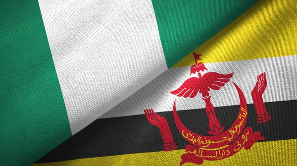 Nigéria e Brunei duas bandeiras tecido — Fotografia de Stock