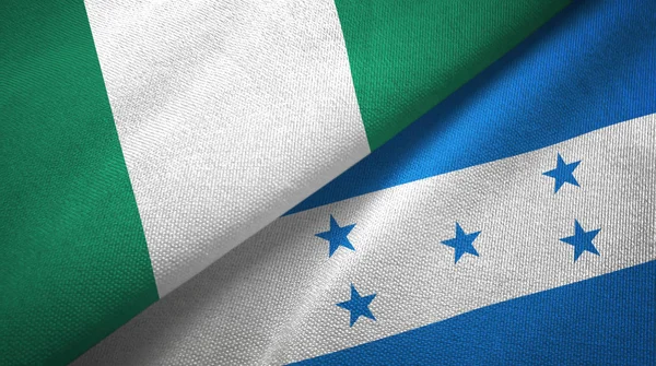 Nigeria en Honduras twee vlaggen textiel doek, weefsel textuur — Stockfoto