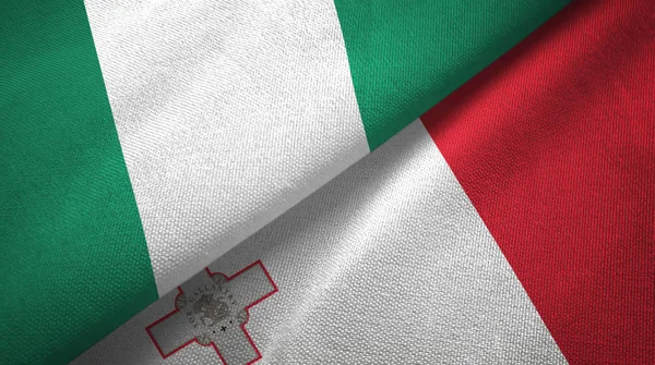 Nigeria i Malta dwie flagi tkanina tekstylna, tekstura tkaniny — Zdjęcie stockowe