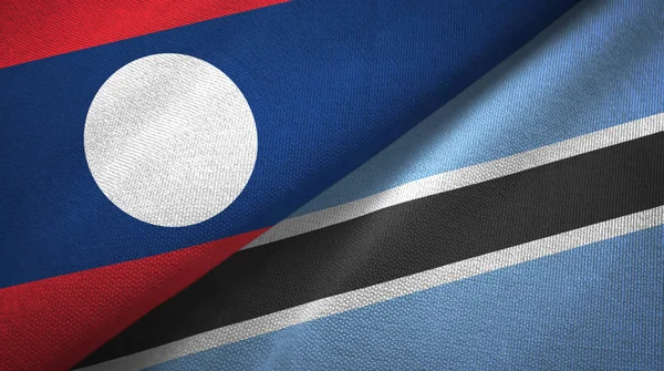 Laos e Botswana duas bandeiras de pano têxtil, textura de tecido — Fotografia de Stock