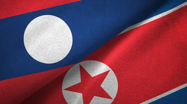 Laos en Noord-Korea twee vlaggen textiel doek, weefsel textuur — Stockfoto