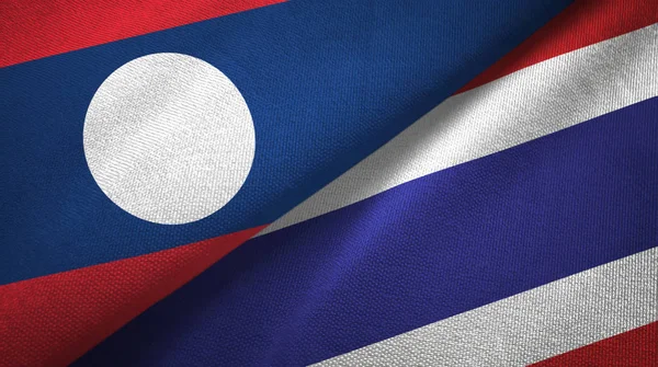 Laos e Tailândia duas bandeiras de pano têxtil, textura de tecido — Fotografia de Stock