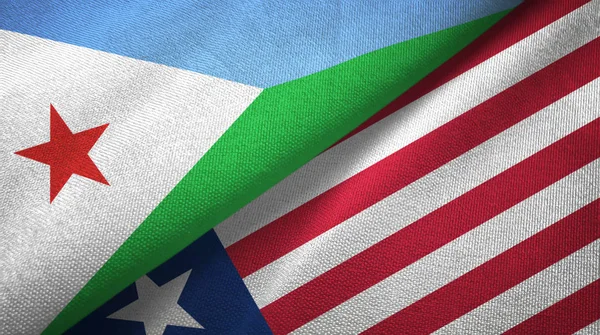 Djibouti en Liberia twee vlaggen textiel doek, stof textuur — Stockfoto