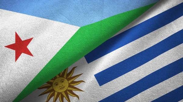 Djibouti and Uruguay two flags textile cloth, fabric texture — Stock Photo, Image