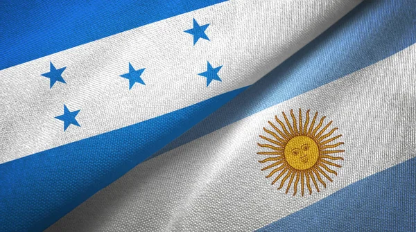 Honduras och Argentina två flaggor textil trasa, tyg konsistens — Stockfoto