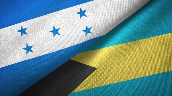 Honduras en de Bahama's twee vlaggen textiel doek, weefsel textuur — Stockfoto