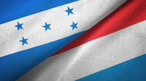 Honduras e Lussemburgo due bandiere tessuto, tessitura tessuto — Foto Stock