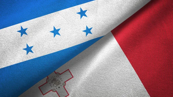 Honduras en Malta twee vlaggen textiel doek, stof textuur — Stockfoto