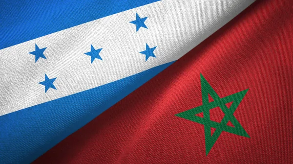 Honduras en Marokko twee vlaggen textiel doek, weefsel textuur — Stockfoto