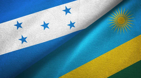 Honduras och Rwanda två flaggor textil trasa, tyg konsistens — Stockfoto