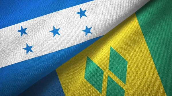 Honduras en Saint Vincent en de Grenadines twee vlaggen textiel doek — Stockfoto