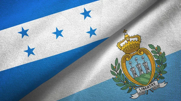 Honduras e San Marino due bandiere tessuto, tessitura tessuto — Foto Stock