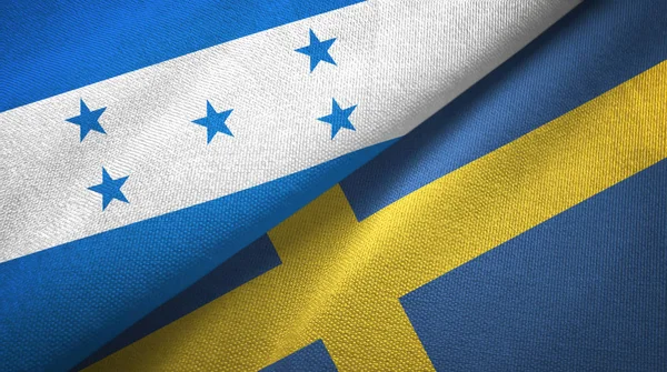 Honduras y Suecia dos banderas de tela textil, textura de tela —  Fotos de Stock
