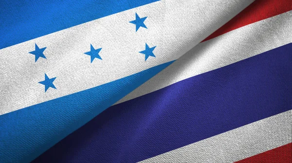 Honduras en Thailand twee vlaggen textiel doek, weefsel textuur — Stockfoto