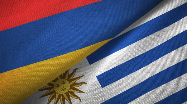 Armenia y Uruguay dos banderas de tela textil, textura de tela —  Fotos de Stock