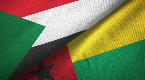 Sudan e Guinea-Bissau due bandiere tessuto, tessitura tessuto — Foto Stock