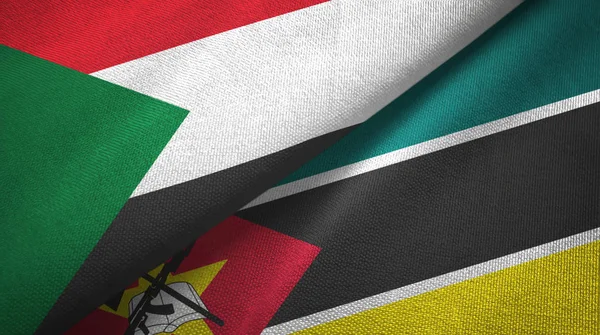 Sudan i Mozambik dwie flagi tkanina tekstylna, tekstura tkaniny — Zdjęcie stockowe