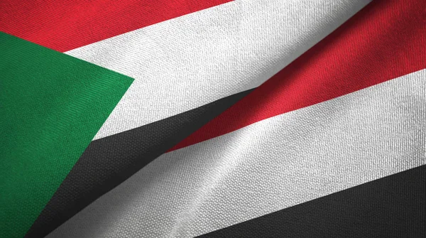 Súdán a Jemen dvě vlajky textilní tkaniny, textura textilií — Stock fotografie