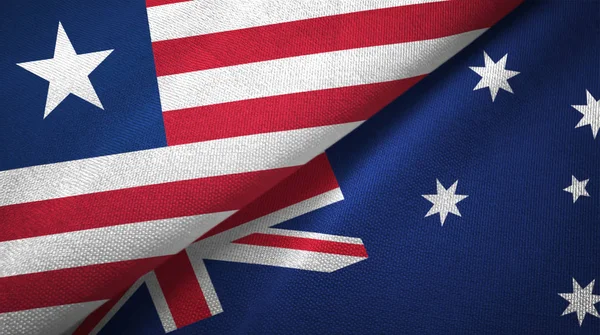 Liberia and Australia two flags textile cloth, fabric texture — Stock Photo, Image
