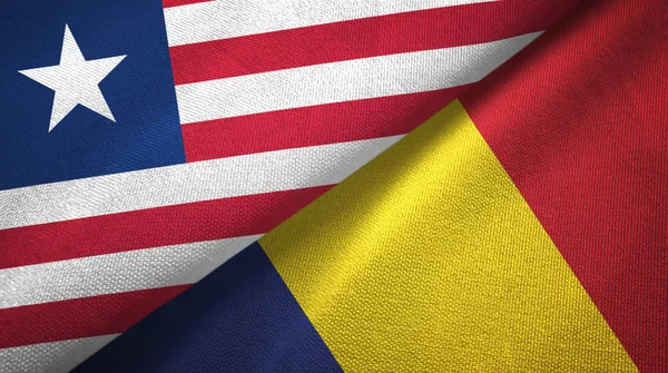 Liberia and Chad two flags textile cloth, fabric texture — Stock Photo, Image