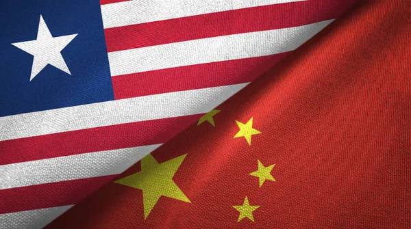 Liberia and China two flags textile cloth, fabric texture — Stock Photo, Image