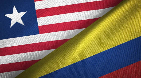 Liberia och Colombia två flaggor textil trasa, tyg konsistens — Stockfoto