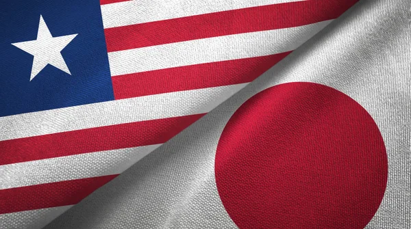 Liberia and Japan two flags textile cloth, fabric texture — Stock Photo, Image