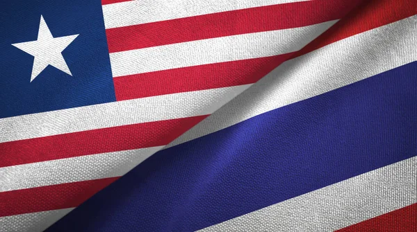 Liberia e Thailandia due bandiere tessuto, tessitura tessuto — Foto Stock