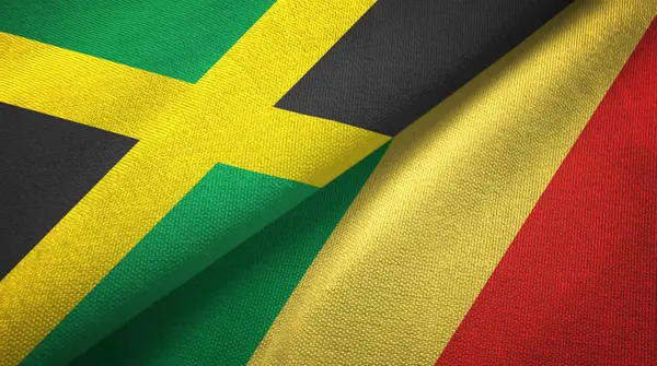 Ямайка и Конго два флага текстильная ткань, текстура ткани — стоковое фото