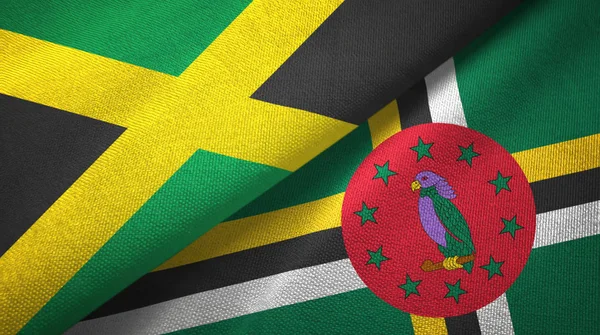 Jamaïque et Dominique deux drapeaux tissu textile, texture du tissu — Photo