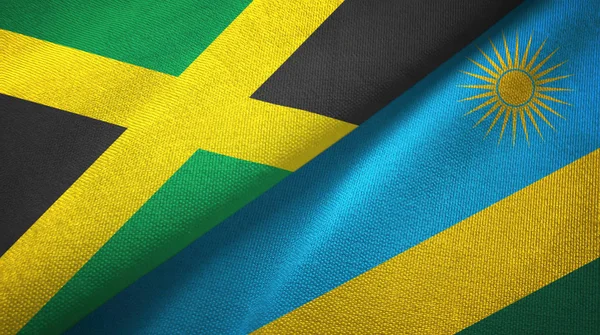 Ямайка и Руанда два флага текстильная ткань, текстура ткани — стоковое фото