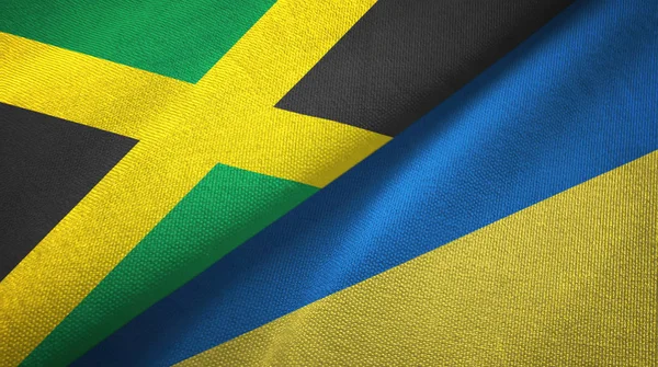 Ямайка и Украина два флага текстильная ткань, текстура ткани — стоковое фото