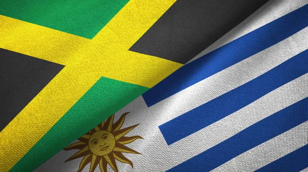 Jamaica und uruguay zwei flaggen textilgewebe, textur — Stockfoto