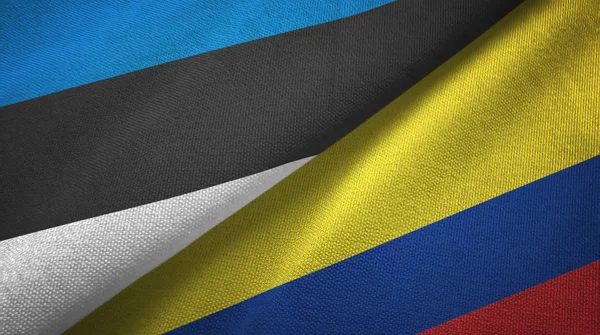 Estónia e Colômbia duas bandeiras de pano têxtil, textura de tecido — Fotografia de Stock