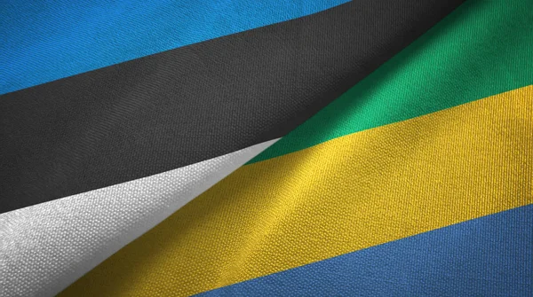 Estland und Gabon zwei Flaggen Textiltuch, Textilstruktur — Stockfoto