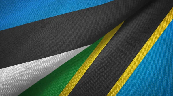 Estland und Tansania zwei Flaggen Textilstoff, Textiltextur — Stockfoto