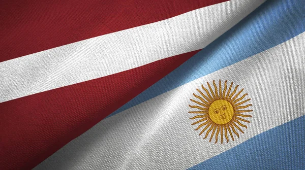 Lettonia e Argentina due bandiere tessuto, tessitura tessuto — Foto Stock