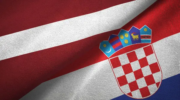 ラトビアとクロアチア2つの旗織物布、生地の質感 — ストック写真