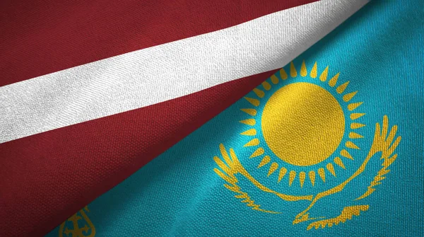 Latvia and Kazakhstan two flags textile cloth, fabric texture